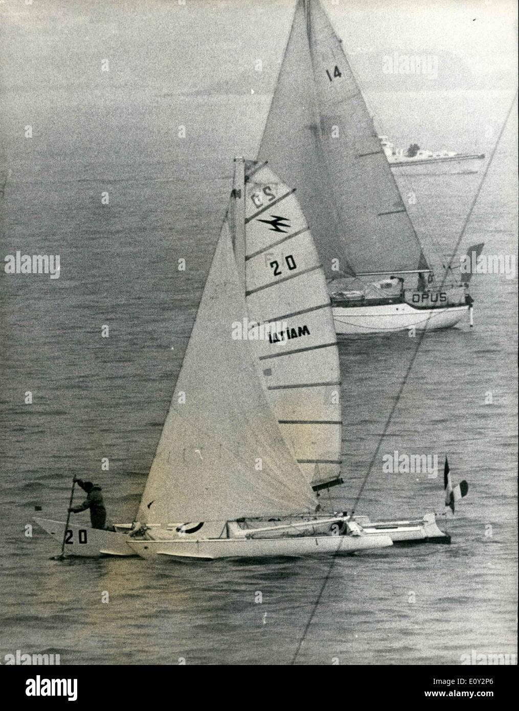 Jun. 06, 1968 - The Start of the Single Handed Translating Yacht race from Plymouth. 35 Yacht set out from Plymouth yesterday on the 3,000 mile single handed race across the Atlantic to Newport , Rhode Island . The race started in almost flat Calm and pouring rain. Photo shows Comndt. B.Waquet (France) tries to get his Sloop (Tri) ''Tamoure'' moving by using a 'Sweep' soon after the start. In the background is the sloop ''OPUS'', U.K. crewed by bank manager B.T.A Cooke. Stock Photo