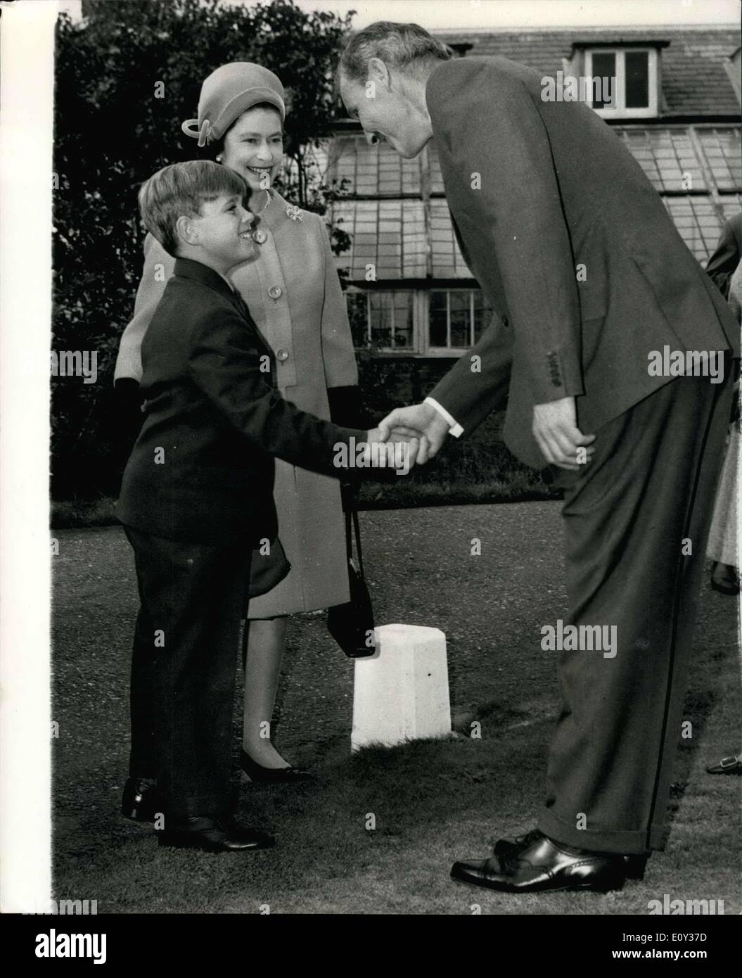Sep. 14, 1968 - Prince Andrew goes to school: H.M The Queen looks on as her son, Prince Andrew, aged 8, shakes hands with Mr. James Edwards, headmaster of Heatherdown Preparatory School, at Ascot, Berks, yesterday. Prince Andrew had just arrived to sign on as as a boarder at the school. He joins 80 other boarders at the school.He eight and thirteen. He will sleep in a dormitory and go to chapel daily. Stock Photo