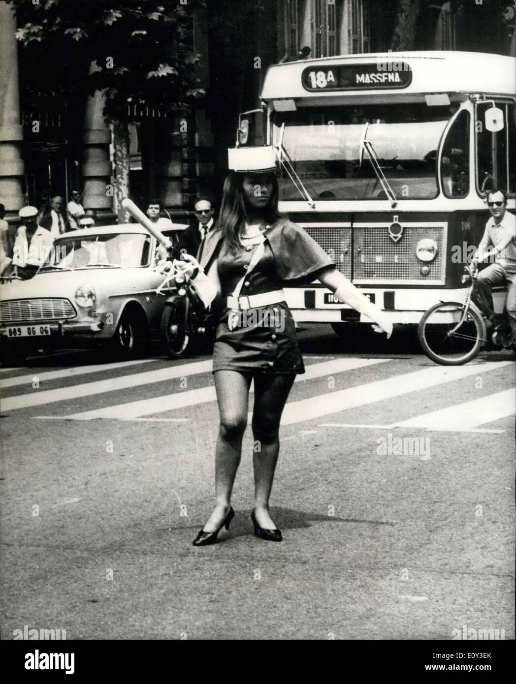 Jul. 06, 1968 - What Every Mptorist Would Like To See Fncy being held up by this mini-skirted charmer. Drivers in Nice loved taking directions from this baton-wielding charmer, wearing a military-style kepi, who took pver the traffic ( with official permission, of course) during a busy period. The girl was one a team who were hostesses at a gala and congress of architects being held at nearby Cap d'Antibes. Stock Photo