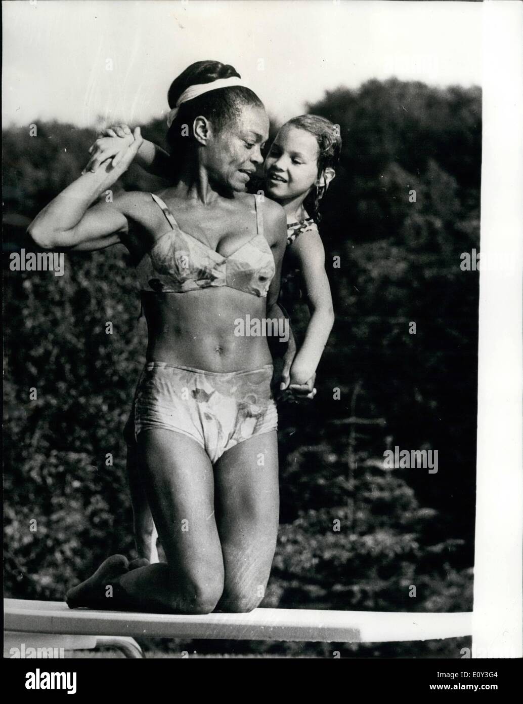 Jul. 07, 1968 - Eartha Kitt In Copenhagen: The famous singer Eartha Kitt, whose voice can be enjoyed in the next few weeks during her performance in Tivoli Varieteen in Copenhage, pictured here during a break in rehearsal and performance, with her seven year old daughter. Stock Photo