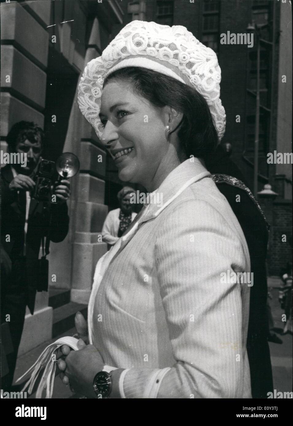 Jul. 07, 1968 - Princess Margaret Attends General Meeting Of NSPCC: H.R.H. Princess Margaret attended the annual general meeting of the National Society for the Prevention of Cruelty to Children, held at St. Pancras Town Hall this afternoon. Photo Shows Princess Margaret wearing a white hat, lemon coat and outsize skin divers watch. Her happy smile is topped by a bright white beret-type hat of lace flowers. Stock Photo