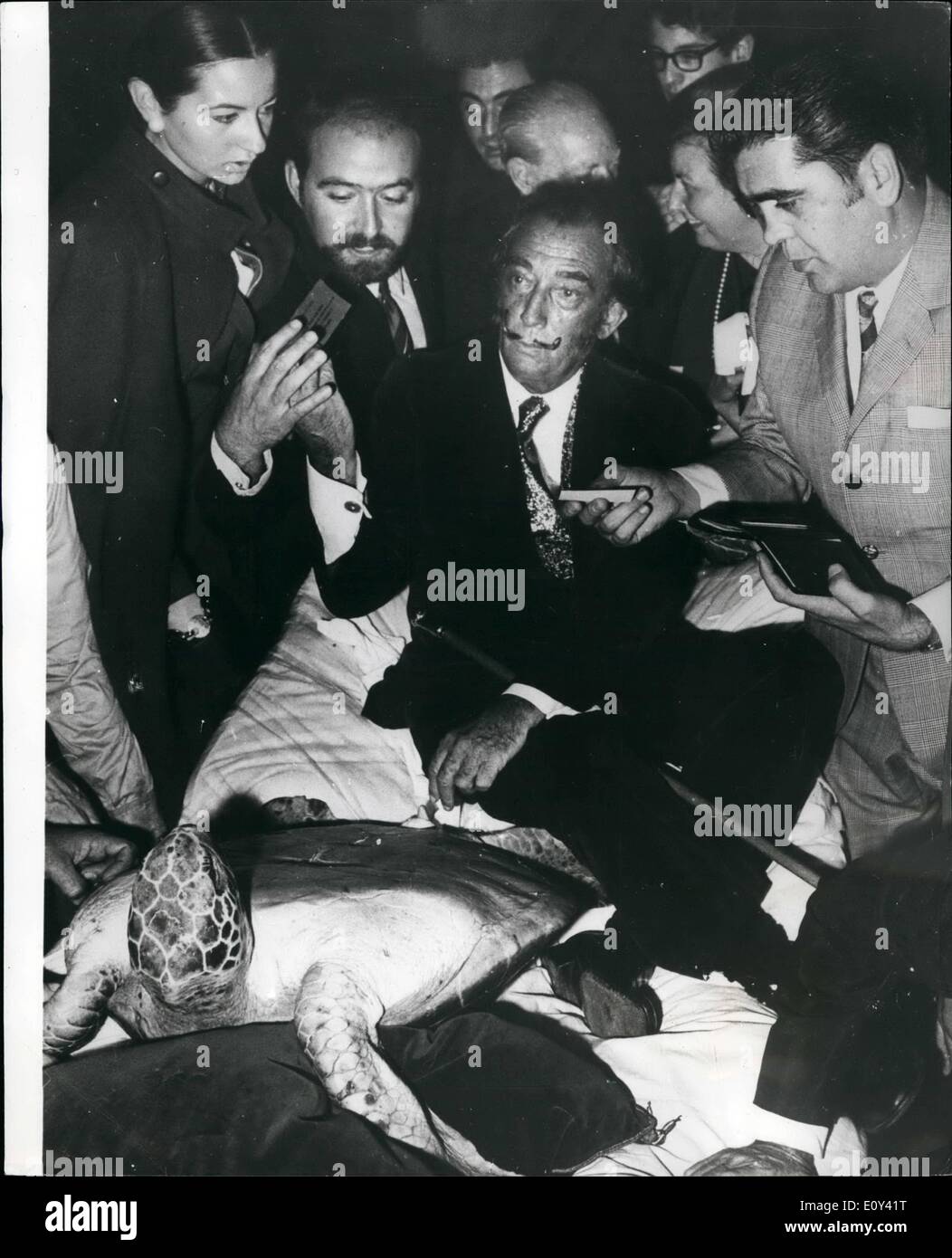 Oct. 10, 1968 - Salvador Dali uses turtle as table to sign autographs in Barcelona; Photo Shows The famous artist Salvador Dali, pictured when he signed autographs in Barcelona using as a table the turtle which was sent from Brazil to Barcelona, on which he will paint some drawings and then put it into the sea. Stock Photo