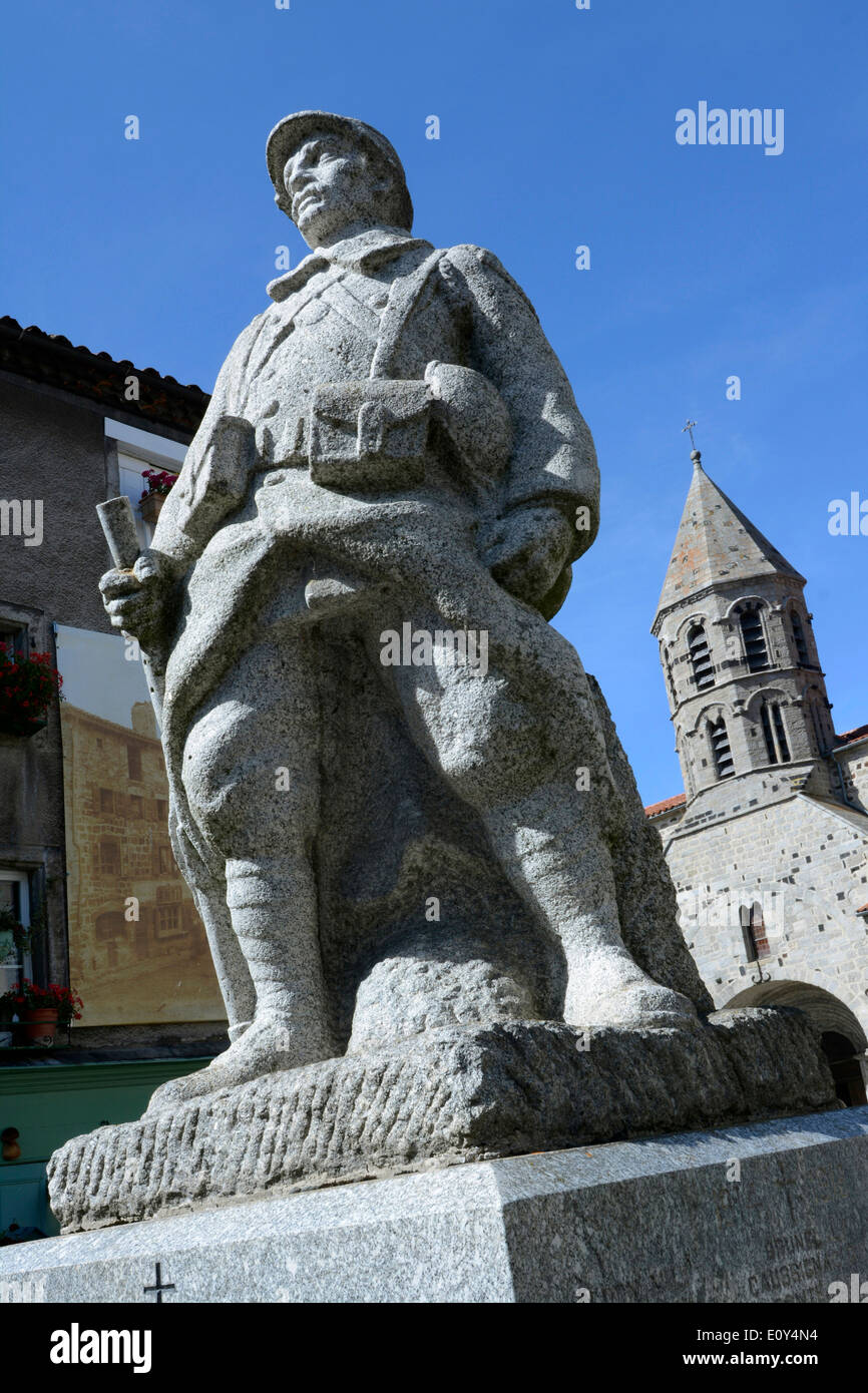 War memorial and church in the village of Saugues, Gévaudan, Haute Loire, Auvergne, France, Europe Stock Photo