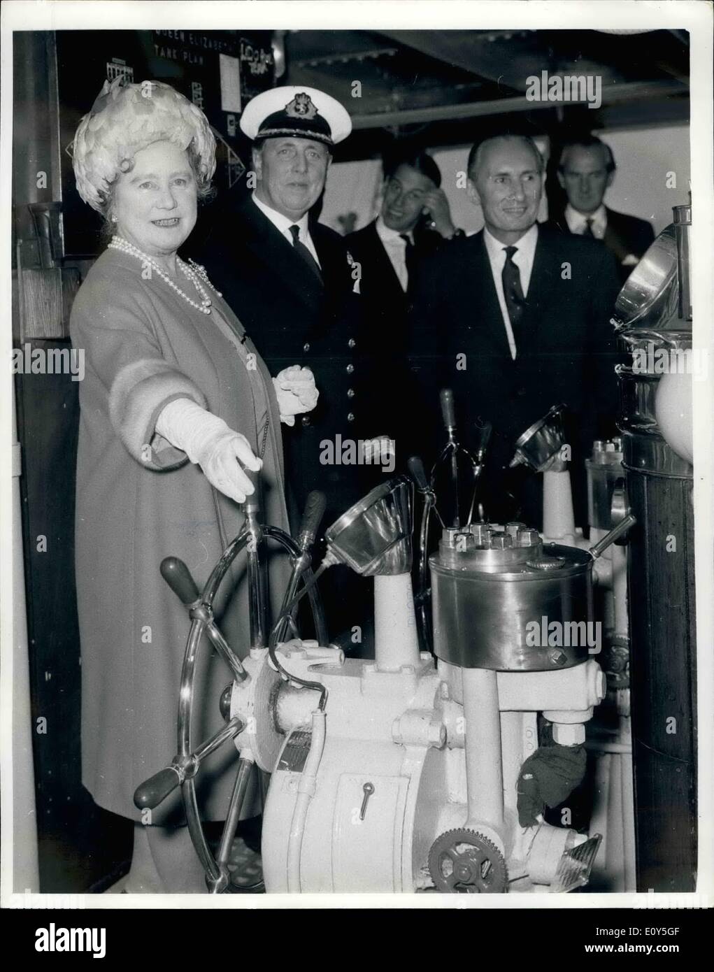 Nov. 11, 1968 - Farewell visit to ship she named.: Southampton: Queen Elizabeth, The Queen Mother, at the wheel of the Cunard Liner Queen Elizabeth which she named and launched 30 years ago. The Queen mother paid a ''goodbye'' visit ti the world's largest liner here today before she sails to retirement at Port Everglades, FLorida. Next to her is Capt. Geoffrey Thrippleton Marr, Commondore of the Cunard Fleet. Stock Photo