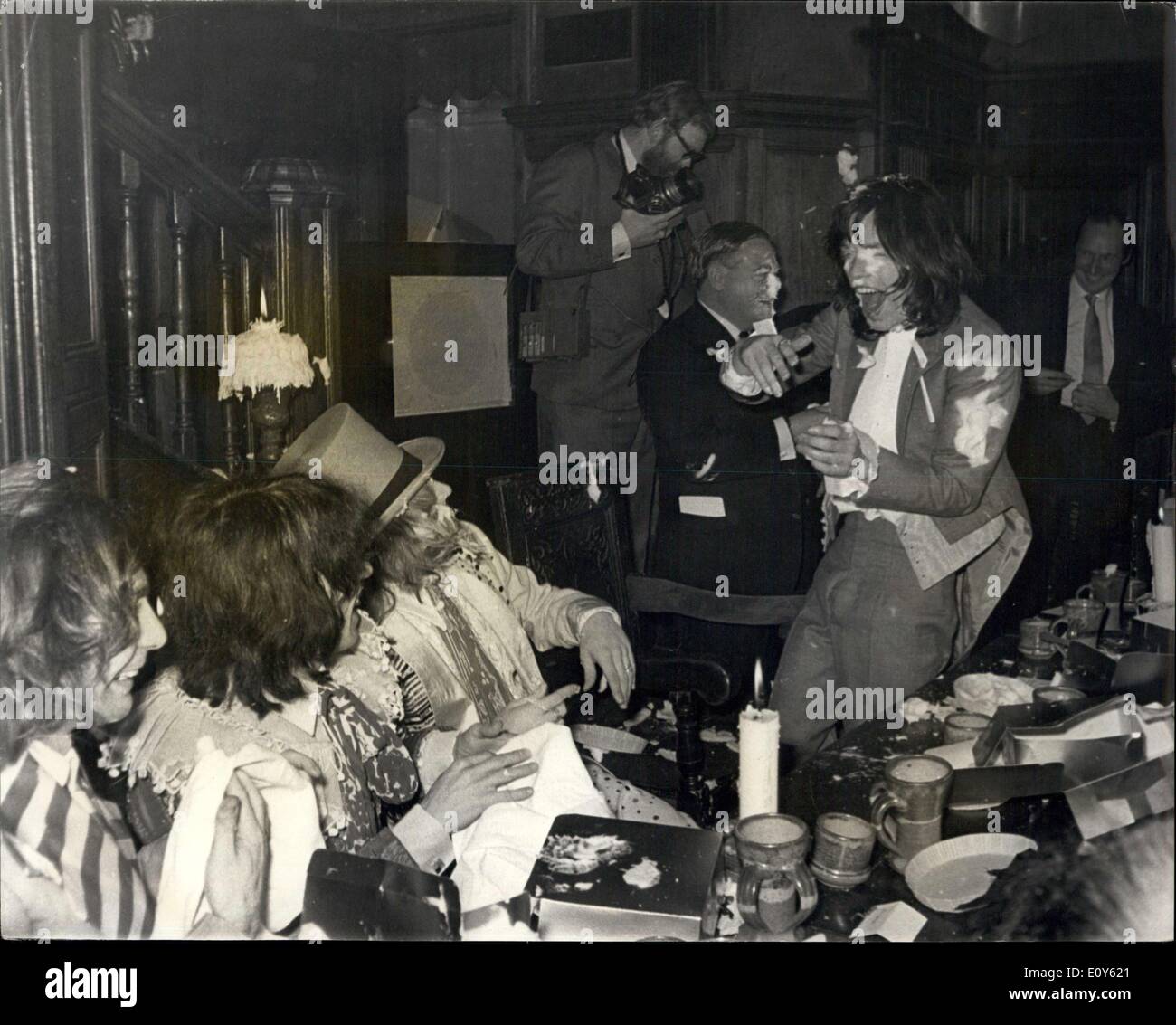 Dec. 05, 1968 - Custard Pie Throwing At Beggars Banquet Given By The Rolling Stones. The Rolling Stones today held a Beggars Banquet, with serving wenches, etc., to which a number of journalists friends, television folk et al, were invited, in the Elizabethan Room, Gore Hotel, Queensgate, The Banquet was rounded up with a custard pie battle. Photo Shows: Rolling Stone Mick Jagger, on right, having fun during the custard pie throwing today. Stock Photo
