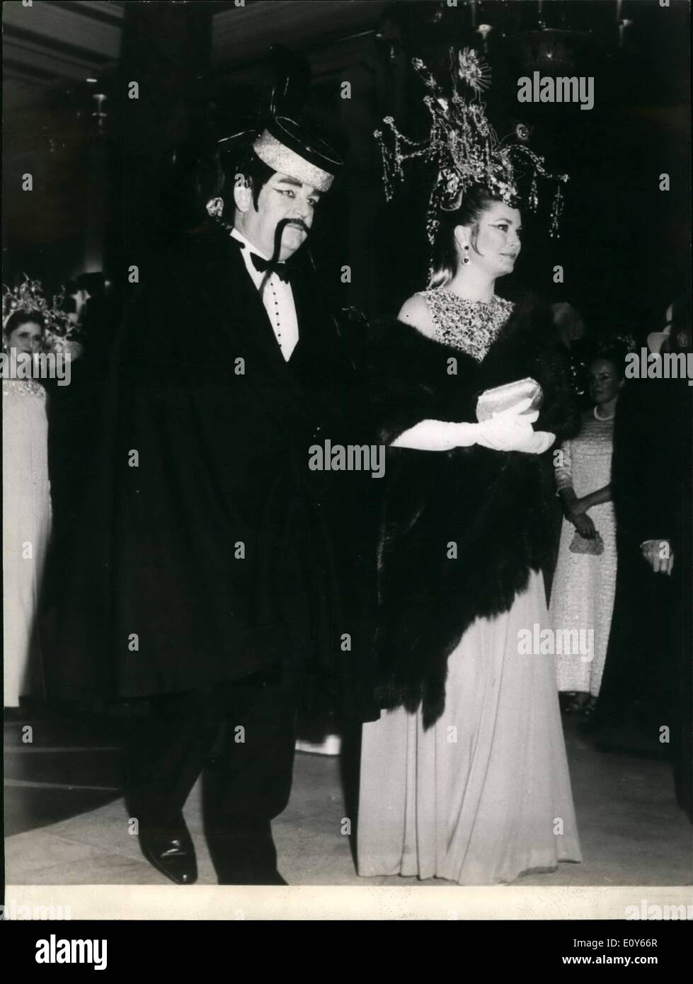Mar. 03, 1969 - Fancy dress ball in Monte Carlo; A Fancy dress ball patronized by Prince Rainer and Princess Grace was held in the Monte Carlo Casino yesterday. Photo Shows Prince Rainier dressed as a Mandarin pictured with Princess grace displaying a fancy headdress. Stock Photo