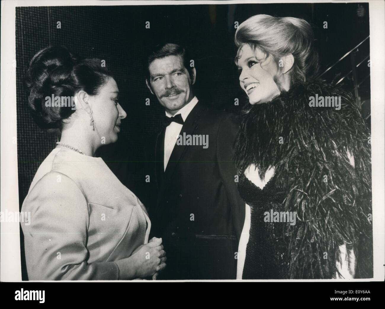 Dec. 12, 1968 - Princess And Brigitte Converse In French: Princess Margaret talking in French with Brigitte Bardot with, in center, Stephen Boyd, at the Royal Charity Premiere of the film Shalako at the Leicester Square Theater, London, last night (Wednesday). Afterwards Brigitte Bardot, star of the film. said. ''I was surprised when the Princess spoke to me in French.'' The premiere, sponsored by the Variety Club of Great Britain, is in aid of the Dockland Settlements, the Jewish National Fund Charitable Trust, and Variety's Heart Fund for under-privileged children. Stock Photo