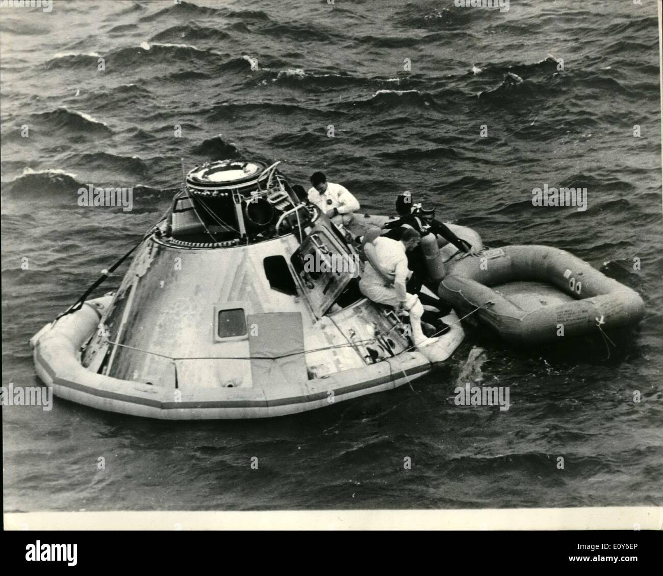 Mar. 03, 1969 - Apollo 9 Spacecraft Splashes Down in Atlantic After 10-Day Rehearsal For Putting Man On The Moon: America's three-man Apollo 9 Spacecraft down in the Atlantic 340 miles north of Puerto Rico on March 13th at the end pof a highly successful 10-day rehearsal for putting a man on the moon later this year.Photo Shows Apollo 9 Astronaut Russell L. Schweickart sits on open space craft hatchway prior to joining David R. Scott in life raft following Splashdown with Commander James A.McDivitt, in spacecraft. Stock Photo