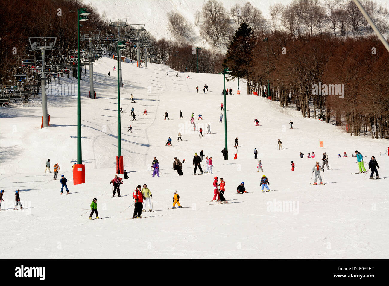 Super Besse ski resort, Auvergne, France - people skiing down the piste Stock Photo