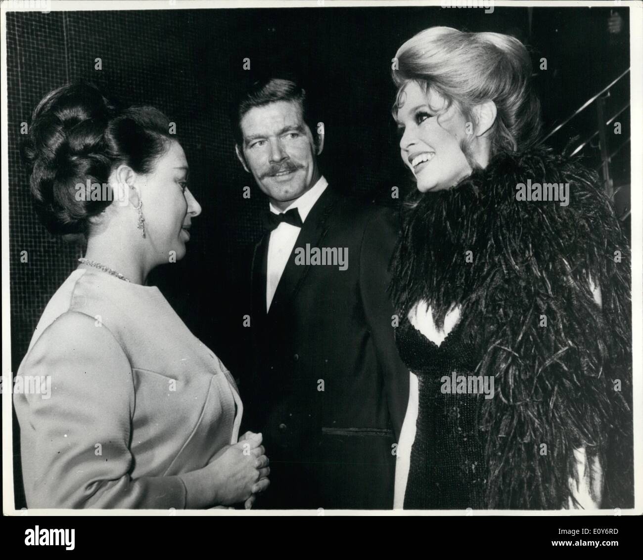 Dec. 12, 1968 - Princess and Brigitte converse in French. Princess Margaret talking in French with Brigitte Bardot, in center, Stephen Boyd, at the Royal Charity premiere of the film Shalako at the Leicester Square Theatre, London, last night (Wednesday). Afterwards Brigitte Bardot, star of the film said: ''I was surprised when the Princess spoke to me in French''. The premiere, sponsored by the variety club of Great Britain, is in aid of the Dockland Settlements, the Jewish National Fund Charitable Trust, and Variety's Heart Fund for under privileged children. Stock Photo