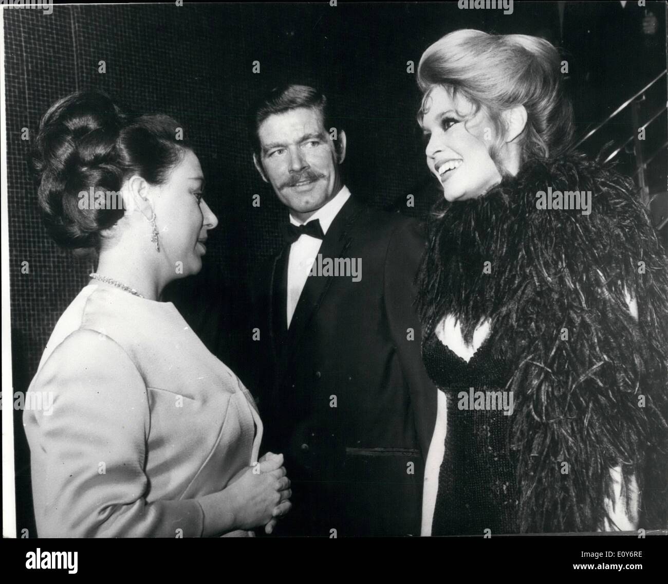 Dec. 12, 1968 - Princess and Brigitte Converse in French. Princess Margaret talking in French with Brigitte Bardot, in center, Stepehn Boyd, ath the Royal charity premiere of the film Shalako at the Leicester Square Theatre, London, last night (Wednesday). Afterwards Brigitte Bardot star of the film, said '' I was surprised when the Princess spoke to me in French''. The Premiere, sponsored by the Variety Club of Great Brrtain, is in aid of the Dockland Settlements, the Jewish National Fund Charitable Trust, and Variety's Heart Fund for under privileged children. Stock Photo