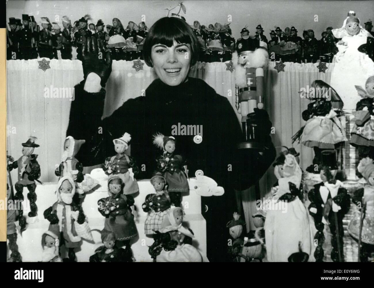 Dec. 14, 1968 - Beautiful French singer Mireille Mathieu is seen here in Munich enjoying the ''Zwetschgenmanderl'' dolls. She bought several to bring home to family. Stock Photo