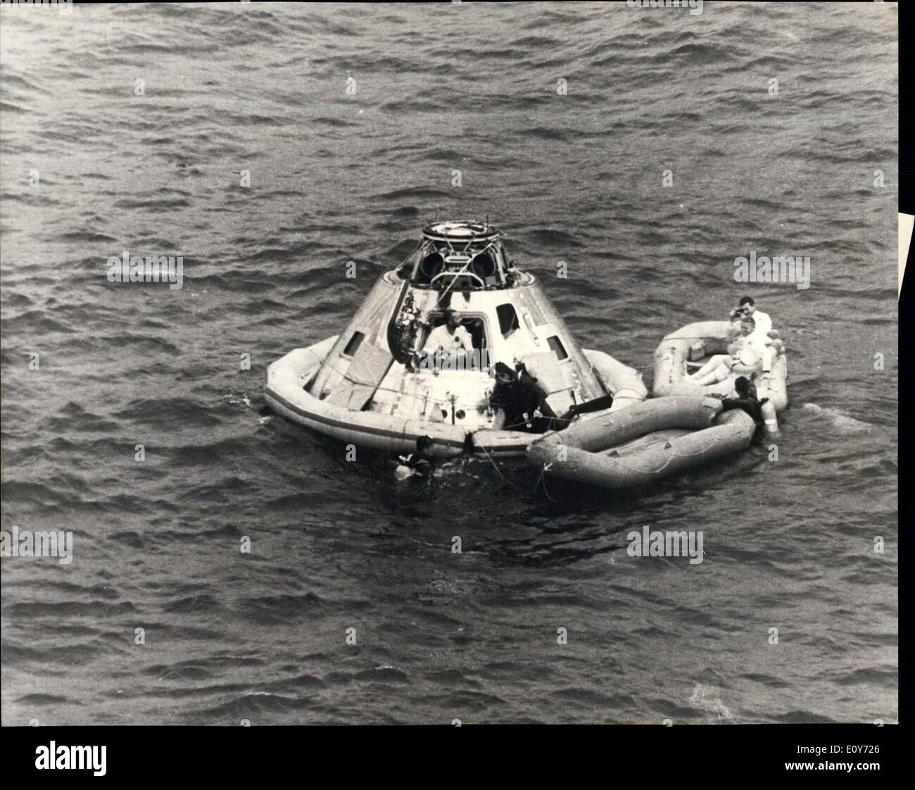 Mar. 18, 1969 - Apollo 9 spacecraft splashes down in Atlantic after 10-day rehearsal for putting man on the moon: America's three man Apollo 9 spacecraft splashed down in the Atlantic 340 miles north of Puerto Rico on March 13th, at the end of a highly successful 10-day rehearsal for putting a man on the moon later this year. Photo shows Apollo 9 astronaut David R. Scott at commander James A. McDivitt as he prepares to leave spacecraft through open hatchway shortly after splashdown. McDivitt, Scott and Russell L Stock Photo