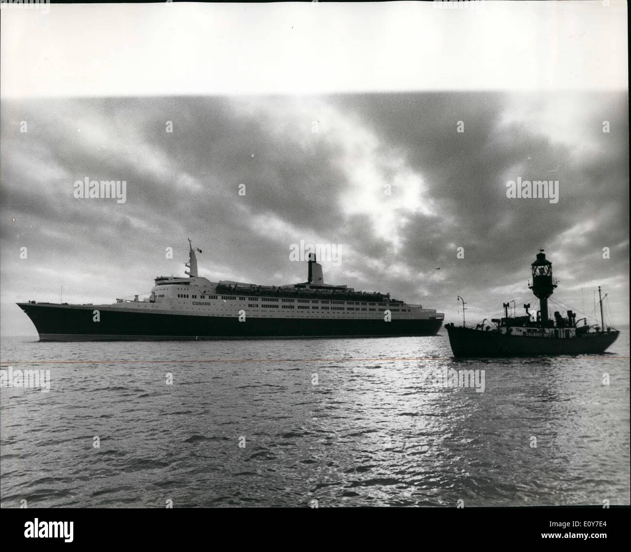 Jan. 01, 1969 - Queen Elizabeth 2 Arrives At Southampton: The 65,000-ton liner Queen Elizabeth 2, which cost 291/2 million to build, limped into Southampton 24 hours late after her trouble-hit trial cruise, and with the mystery fault with her two turbines still unsolved. Photo shows The Queen Elizabeth 2 passing the Calshot Spit light vessel on her way into Southampton yesterday. Stock Photo