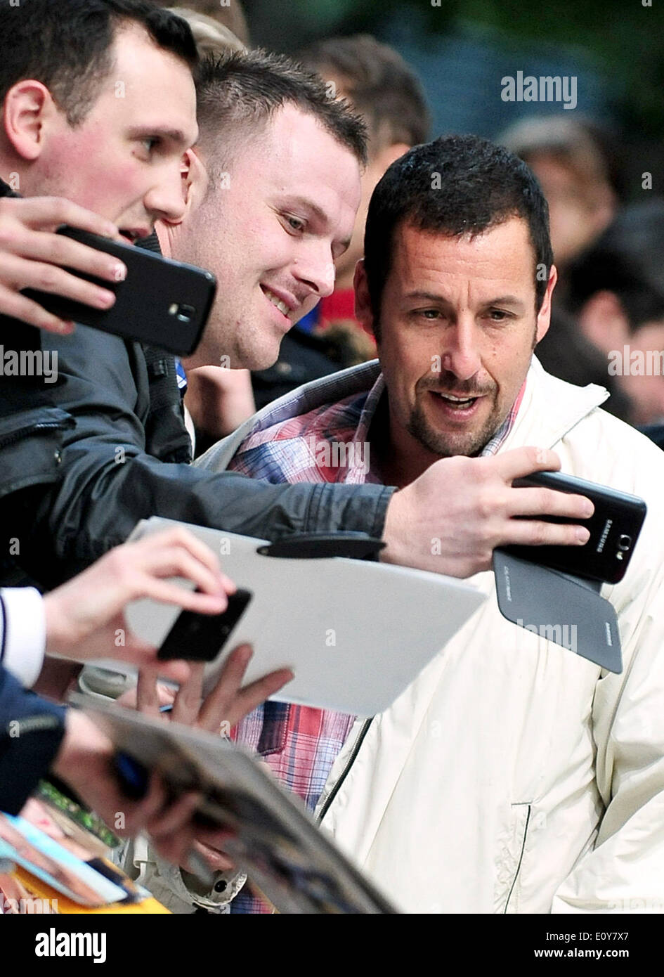 Berlin, Germany. 19th May, 2014. US actor Adam Sandler (R) arrives for the premiere of their film 'Blended' in Berlin, Germany, 19 May 2014. The comedy film is in German movie theaters from 22 May on. Photo: Hauke-Christian Dittrich/dpa/Alamy Live News Stock Photo