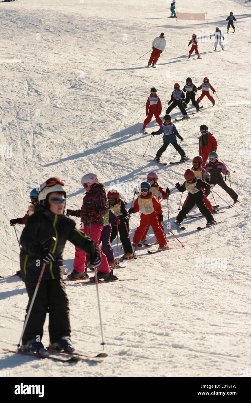 Children at a ski school at a ski resort Stock Photo