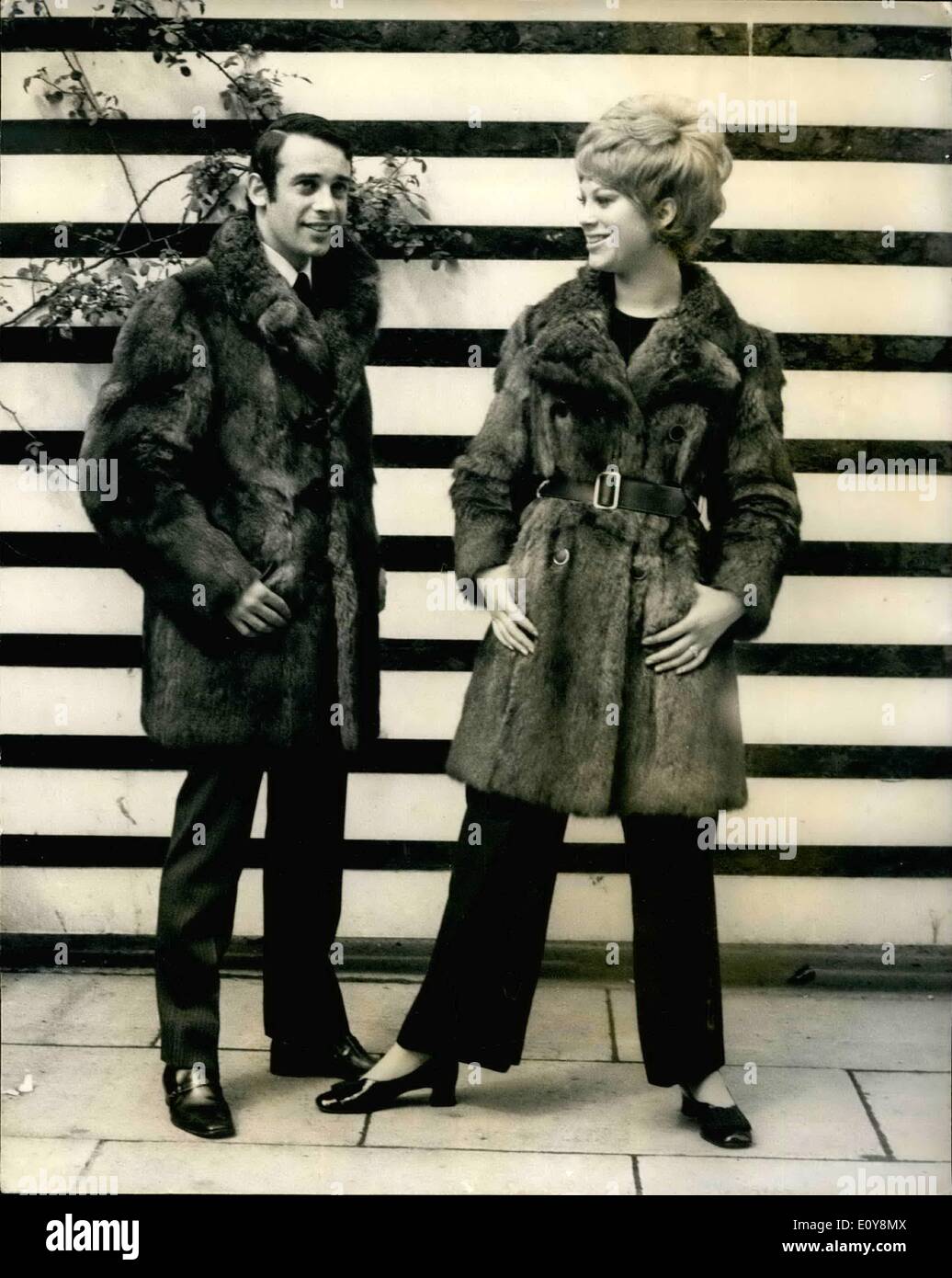 May 05, 1969 - Goodkind fur press shows.: W. Goodkinf and sons Ltd today gave a Press showing of their Autumn 69 Collection of fabulous new furs in London. Photo shows martin Goodkind wears Natural Wallaby man's coat with horn toggles, side slant leather-trimmed pockets, black leather tabs, back venta - Price 158 gas - and Jackie Martin wears Natural Wallaby, D/B, wide revers collar, slanting pockets, leather trimmed. price 158 gns. Stock Photo