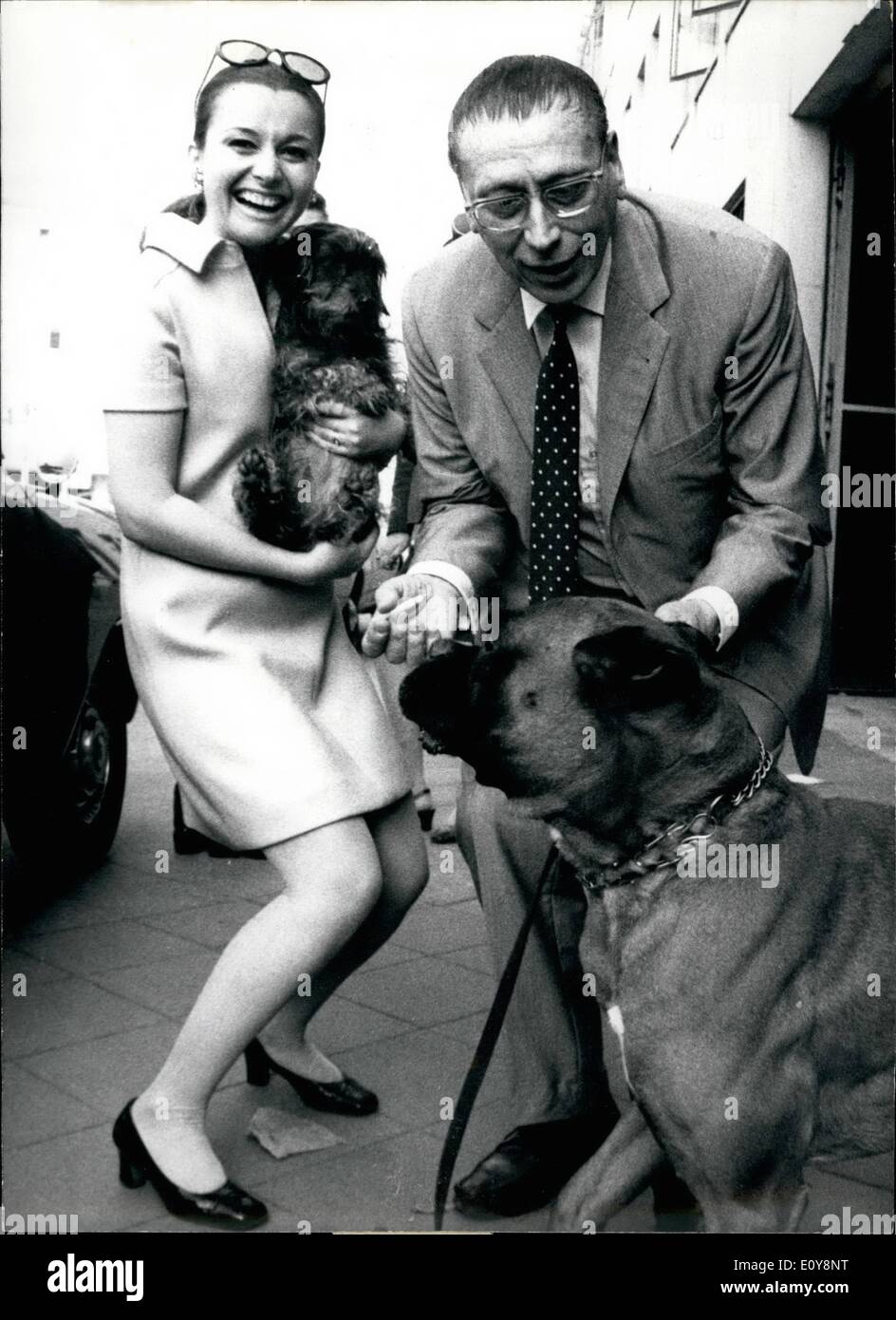 May 05, 1969 - Pictured is G&uuml;nther L&uuml;ders and Margot Phillip. L&uuml;ders is starring in the comedy ''Halbe Wahrheit.'' He is pictured here with his boxer. Brigitte Bardot Dressed Like Gypsy, Lido Cabaret, Paris Stock Photo