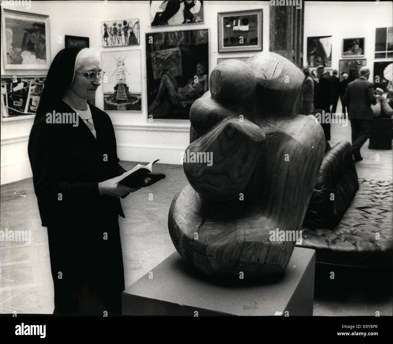 May 05, 1969 - Private view of Royal Academy's Summer Exhibition; Today was Private View day of the Royal Academy's 201st. Summer Exhibition, which opens to the public tomorrow. Photo Shows A member of the Holy Child Order looking at a work called ''mother and child'', in wood, by Jack Bryne-Daniel, at today's Private View. Stock Photo