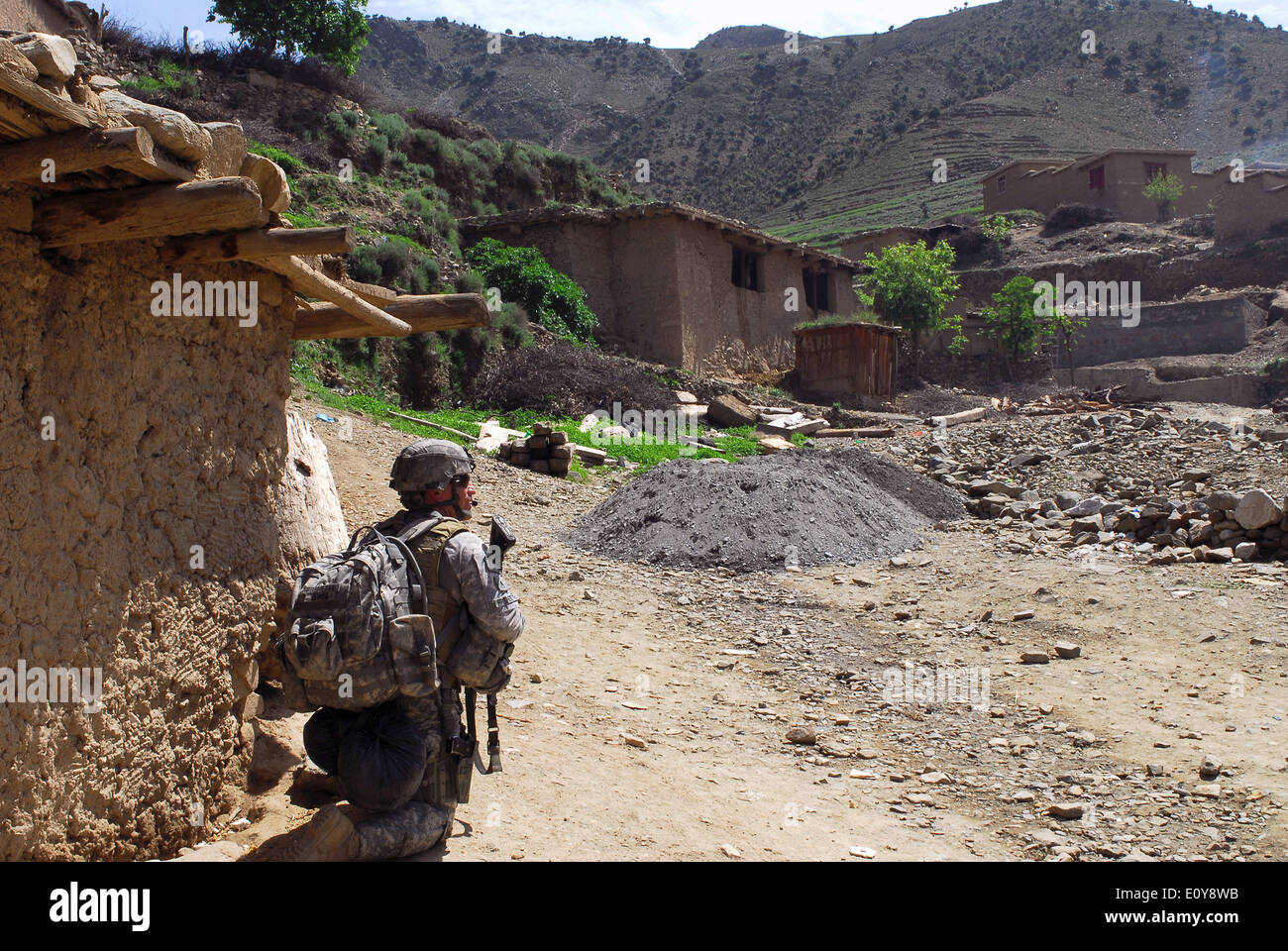 US Army Staff Sgt. Jean-Francois Frenette keeps watch during a mission in a mountain village April 19, 2009 in Kunar province, Afghanistan. Stock Photo