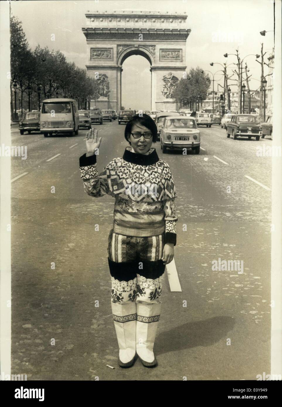 May 06, 1969 - New French Policewoman? No, unluckily just a charming Esquimau woman, who is coming back from an expedition in Groenland, the ''Damart-Thermolacty;'' expedition, and visiting Paris. This expedition was made in order to test the underweares ''Thermolactyl'', famous in all the world by their qualilties of heat keepers and thermic isolation. Photo shows The Esquimau woman acting like a policeman on the champs-elysees. Stock Photo