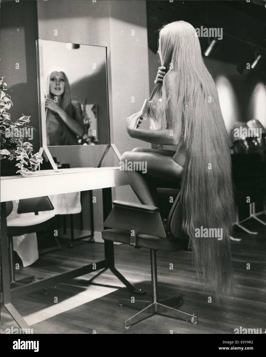Sep. 09, 1969 - The longest wig in the world: Jon, Marc and Paul today opened their new hairdressing salon at 31, Bruton Street, at which a girl wearing the longest wig in the world the Godiva wig was present. Photo shows 19 year old Holly O'Neill, wearing the Godiva wig at the new salon today. Stock Photo