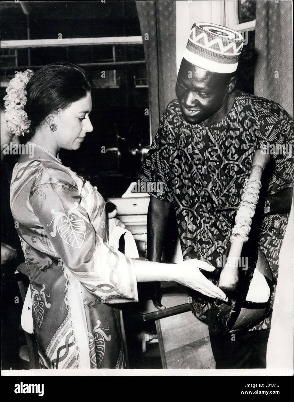 Jun. 13, 1969 - Princess Margaret in a Gaily Coloured Dress Visits Commonwealth Hostel: Princess Margaret wore this gally coloured dress with her hair drawn back and pinned with a circlet of flowers reminiscent of the Japanese fashion, when she paid a visit to two students hostels of the Zebra Trust, meeting and talking with married students and their families from many of the commonwealth countries Stock Photo