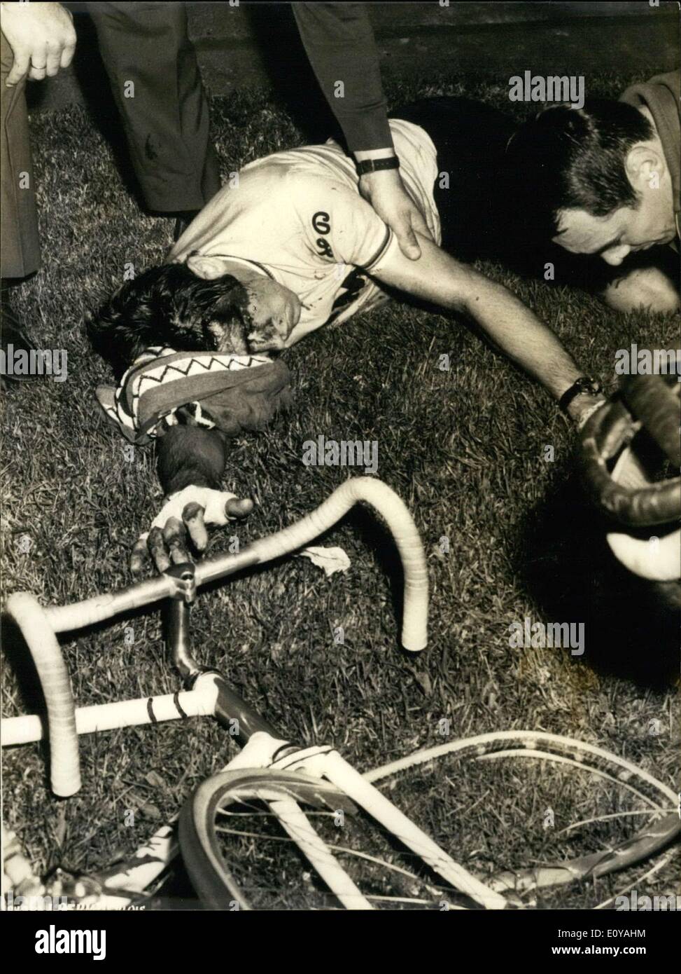 Sep. 11, 1969 - Belgium's champion cyclist Eddy Merckx had the first big wreck of his career while training at the velodrome but an unforturnate fall threw him to the ground where he stayed, stunned, next to his battered bicycle. His coach, Fernand Wambst, was found dead, while Merckx was knocked unconscious. Merckx withdrew from the Tour de France after his coach's death. This is how Merckx was found after his fall, his face covered in blood. Stock Photo