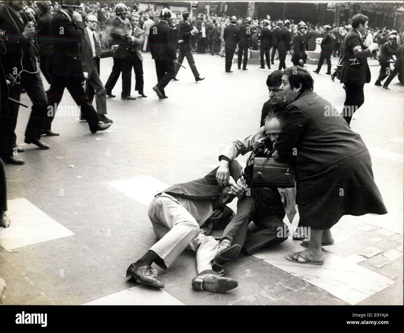 Sep. 13, 1969 - The demonstration held by merchants and artists today in the public eye was forbidden by Mr. Maurice Grimaud, the Chief of Police. The professionals met at the Parc des Princes and were directed by Mr. Gingembre, a general representative of a Small Business Association. After the meeting, demonstrations were provoked by the UNCAP and UNATI and were led by President Bernard Fauliot. The demonstrations quickly turned violent. Two men are seen wounded on the ground in this picture. Stock Photo