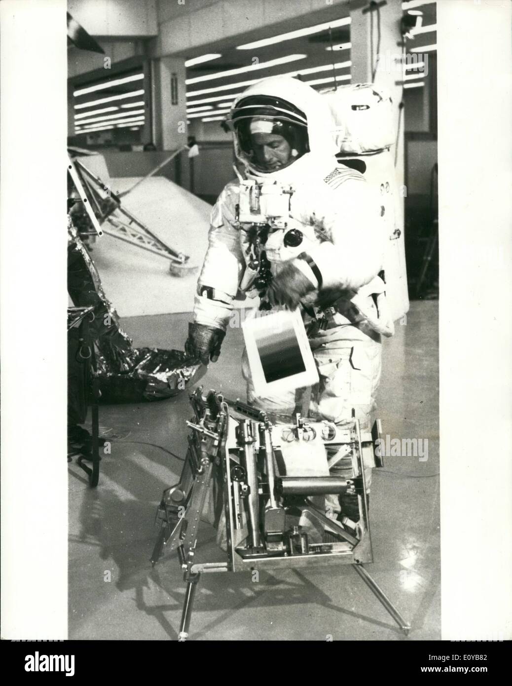 Oct. 10, 1969 - Preparing for Appolo 12 Lunar Mission. Apollo 12 commander Charles Conrad unstows lunar surface exploration equipment from the Lunar Module's Modular Equipment Stowage Bay (MESA) during a recent simulation of Apollo 12 Lunar surface activity at the Spaceport's Flight Crew Training Building at Kennedy Space Centre, Florida. Stock Photo