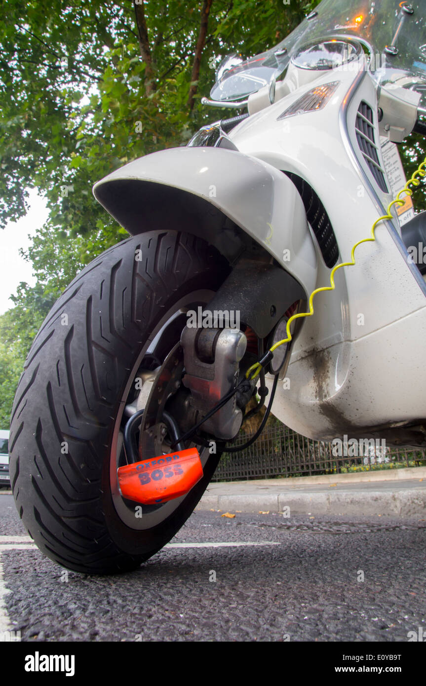 UK, England, London, lock secures scooter Stock Photo