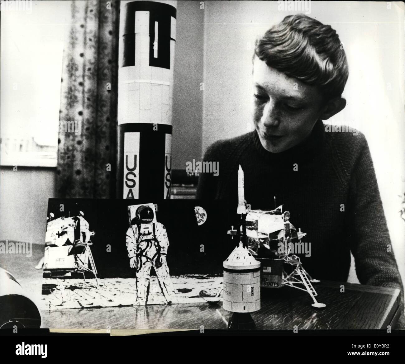 Aug. 08, 1969 - Accuracy of Boy's Painting of Moon Landing Amazes Experts. The accuracy of a painting of man's landing on the Moon, completed three weeks before it happened by a 16-year old boy, has amazed experts. Earlier this week, the artist schoolboy, David Heck Douglas, learned that his pen and ink painting has won him a trip round space control at Houston - and a possible meeting with the astronauts themselves. David's drawing shows a man on the moon near the spacecraft, and even includes the famous footprints on the moon's surface. It was voted by a panel of judges - including Mr Stock Photo