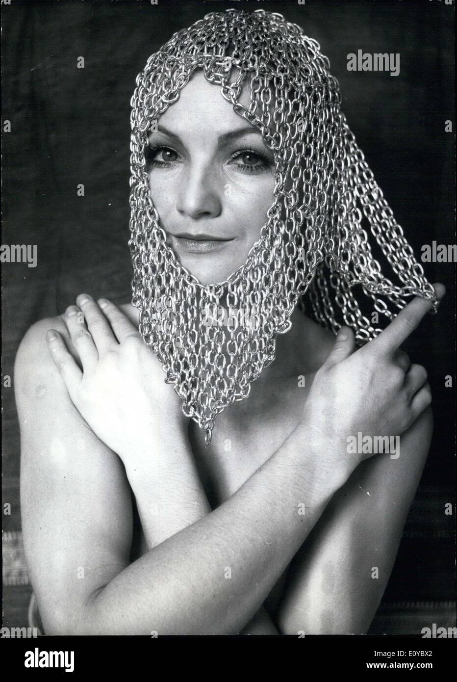 Oct. 13, 1969 - Pictured is Julia Hoff and her unique ''wig'' made from chains. It is seemingly antique, but is actually quite modern. Friends and familiars were in a hubbub to order some from the self-educated artist. Unfortunately, this is just a hobby for her, since the beautiful Julia, of Frankfurt, plans to because an English and art teacher. Stock Photo