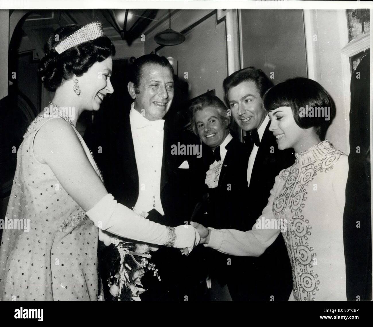 Nov. 11, 1969 - The Royal Variety Performance At The London Palladium: The Queen, accompanied by Prince Philip and Princess Anne, last night attended the Royal Variety Performance at the London Palladium. Photo shows The Queen is introduced to French singer Mireille Mathieu by Bernard Delfont (centre) when she met the stars of last night's show. Also seen looking on are female impersonater, Danny La Rue and compere Des O'Connor (next to Mireille) Stock Photo