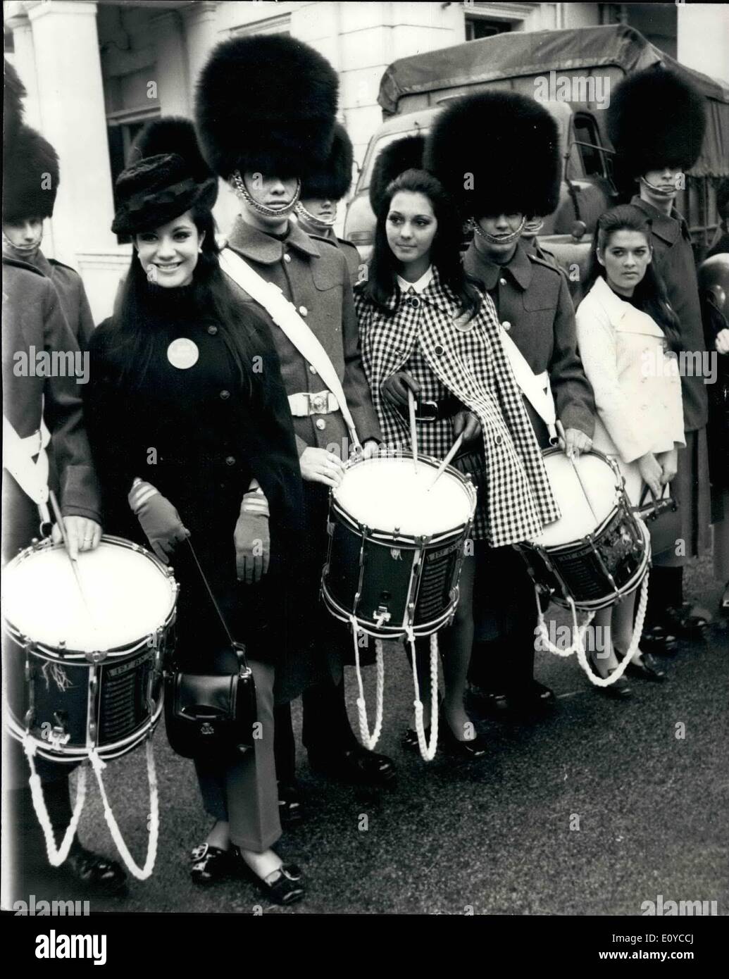 Nov. 11, 1969 - Miss World's Visit Horse Guards: Many of the contestants taking part in the Miss World Contest next Thursday, were out and about in London this morning-one of the first placeses they visited was Wellington Barracks to see the Horse Guards. Photo Shows Seen with members of the Guard Band L-R. Miss Paraguay, and Miss Venezuela. Stock Photo