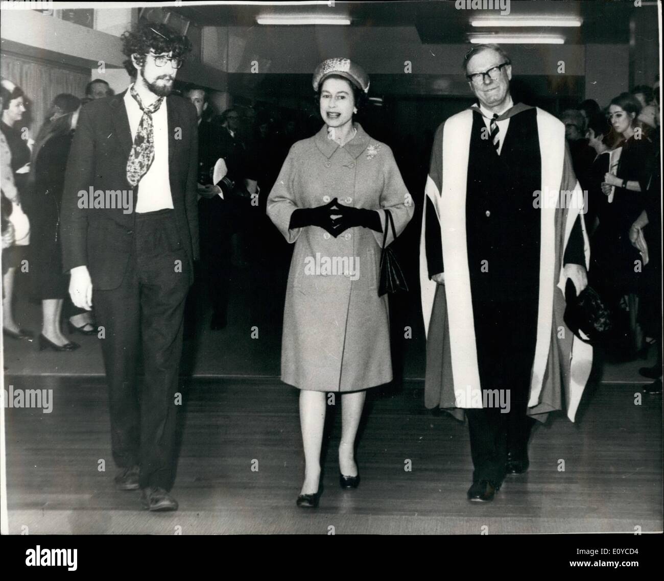 Nov. 11, 1969 - Queen and Duke of Edinburgh opened new college block and libraries of Imperial College of Science and Technology. H.M. The Queen visiting the students common room at the Imperial College of Science and Technology yesterday, with Lord Penny, director (on right) and Mr. P.R. Corbyn, President of the students union, who handed her a letter from the students asking he to consider changing the college charter and for her help on winning other reforms. Mr. Corbyn said the Queens told him she would reply to the letter Stock Photo