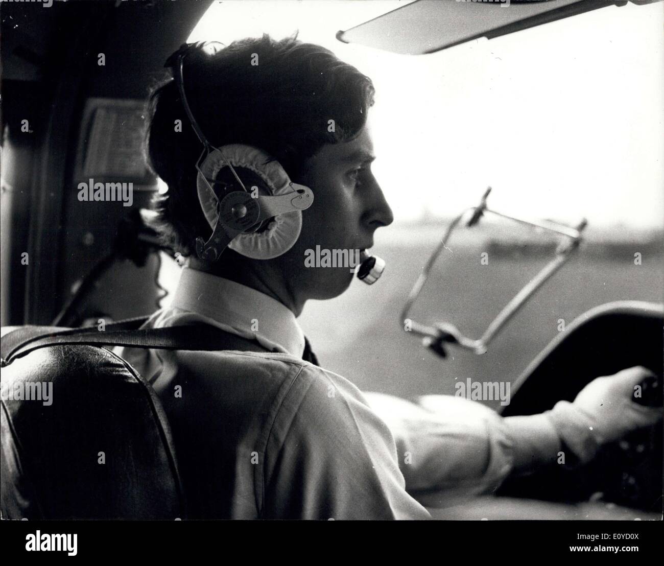 Nov. 14, 1969 - When it came to choosing where his 21st Birthday pictures were to be taken , the Prince of Wales choose RAF Oakington, where he is learning to fly under the instruction of Squadron Leader Phillip Pinney. the Prince, who will be 21 on Friday, November 14th, is now flying a twin engine Basset aircraft. Photo Shows: The Prince of Wales lying the Basset aircraft. Stock Photo