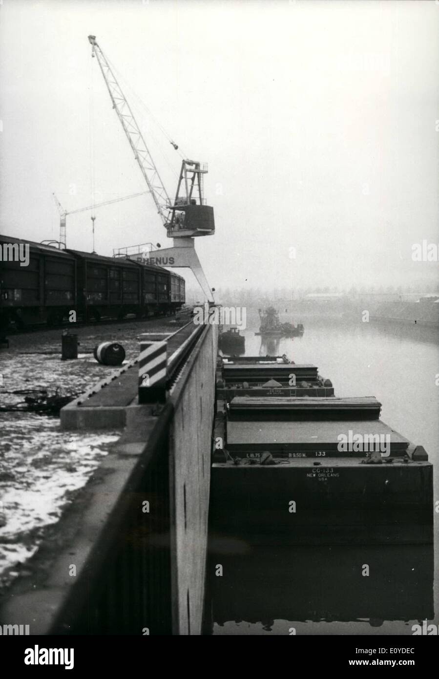 Dec. 12, 1969 - Containers floating from the Mississippi to Cologne, The town of Cologne has become the terminus of a new traffic system connecting the USA with Europe. This traffic system consists of big floating containers conveying goods from the USA to Cologne and back, without being necessary to reload them. Thus Cologne enjoys the advantages of a sea port. The first transport of paper and cellulose which is ear-marked partly for Eastern Europe has now arrived. The floating big containers are harboring on a jetty-wall like ships and 18.75 ms. long,9.30. wide, and 4 ms. high Stock Photo