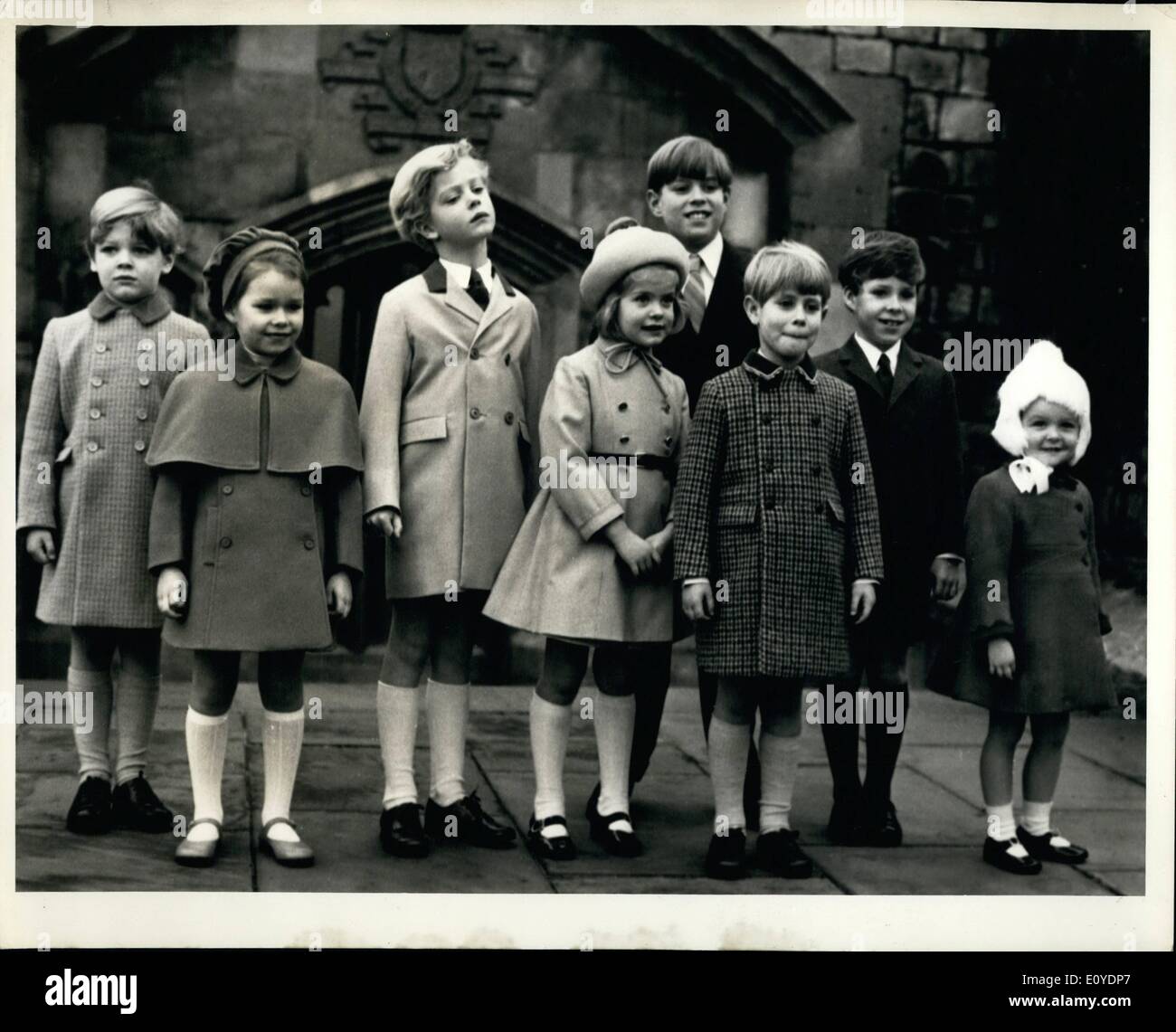 Dec. 12, 1969 - Children Of Royalty: Children Of Britain's Royal Family Pose For A ''Family Group'' At Windsor Castle On Christmas Morning, After They Had Attended Divine Service At St. George's Chapel. From Left To Right: James Ogilvy, Five-Year-Old Son Of Princess Alexandra And The Honourable Angus Ogilvy: Lady Sarah Armstrong-Jones, Five-Year-Old Daughter Of Princess Margaret And The Earl Of Snowdon: The Earl Of St Stock Photo