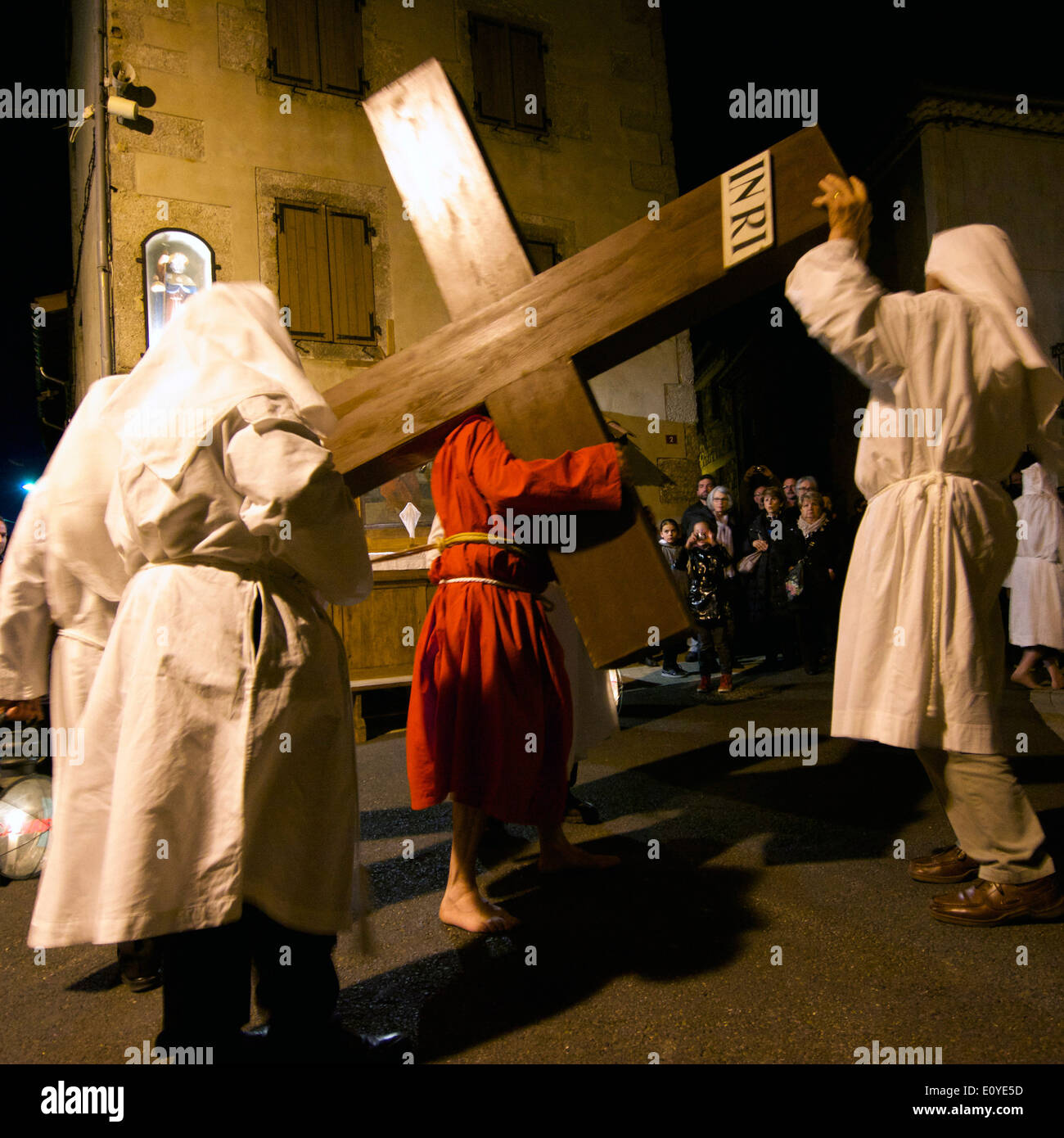 Easter Maundy Thursday religious reenactment of Christ carrying the cross in Saugues village, Haute-Loire, Auvergne, France Stock Photo