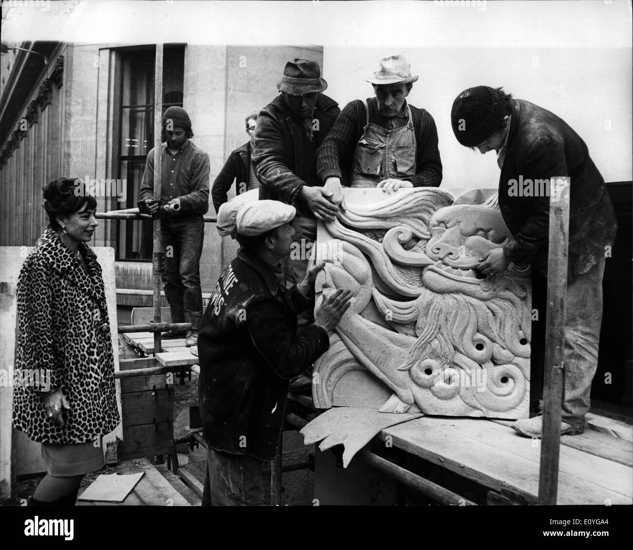 Apr. 04, 1970 - Sculptress Watchers Motifs Placed In Position: Sculptress Mitzi Cunliffe came from Brighton to watch her 6ft. square Scottish motifs being placed in position on the facade of the Scottish Life Assurance Company's new building in the City. Photo shows. Mitzi Cunliffe supervising the placing of the stone blocks today, on the faccade of the Scottish Life Assurance Company's building in the City, today. Stock Photo