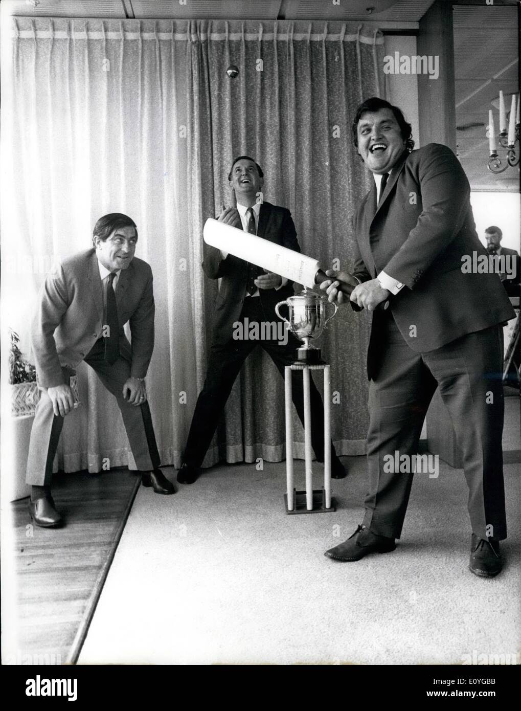 Apr. 04, 1970 - Milburn returns to the wicket and notches up a trophy. Defending the Lawrence Trophy yesterday, Colin Milburn, 28, former Northants opening batsman, after he had been presented with the cup and a &pound;250 cheque for scoring the fastest test century in 1969. He made it off 163 deliveries against Pakistan in Karachi in March. Tom Graveney, the previous holder, who kept wicket with Freddie Truman at first slip at New Zealand House, London, said that everyone was deeply sorry that Milburn was unlikely to be seen in the middle again Stock Photo