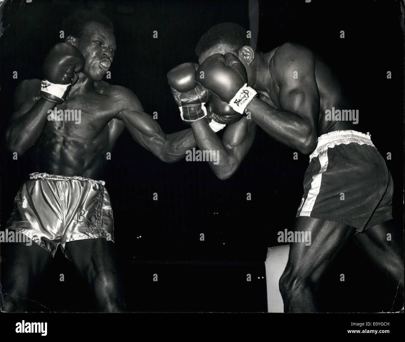 Apr. 04, 1970 - Sterling's Winning way. London: Jamaican-born British and Commonwealth Middleweight champion Bunny Sterling ( left ) gets through the guard of bill ''DYNAMITE'' DOUGLAS, of Columbus, Ohio, during their LO-round Middleweight out at the Royal Albert Hall late 4/27. Sterling outclassed the American to win on Point. Stock Photo
