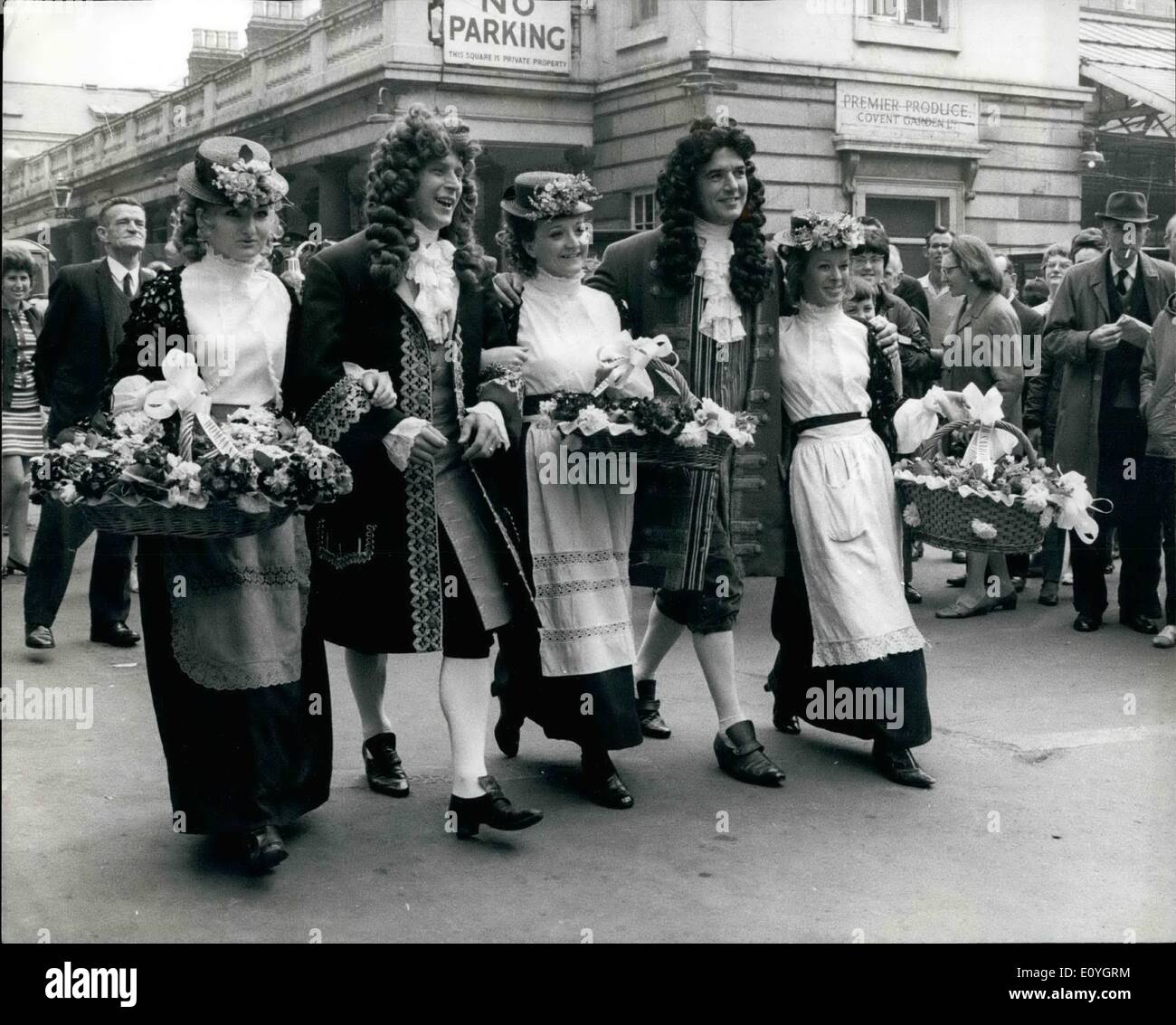 May 05, 1970 - Covent Garden Market Goes Gay For Its 300th. Birthday Celebrations: Covent Garden, London's famous fruit, vegetable and flower market, which was royally chartered by Charles 11 exactly 300 years ago and yesterday the market had a fair to celebrate its tercentenary, Prince Philip attended the celebrations and joined in the fun. Photo shows Girls wearing Elisa Doolittle flower-seller costumes during the 300th birthday celebrations in the market yesterday. The market is to be moved to a new 30-million site at Nine Elms, Vauxhall, in 1973. Stock Photo