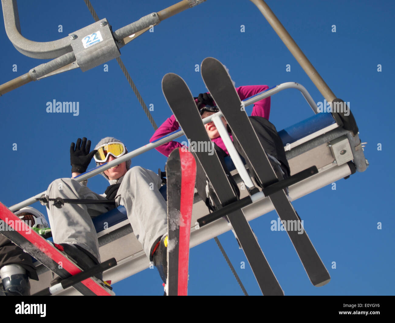 Skiers on a ski lift Stock Photo