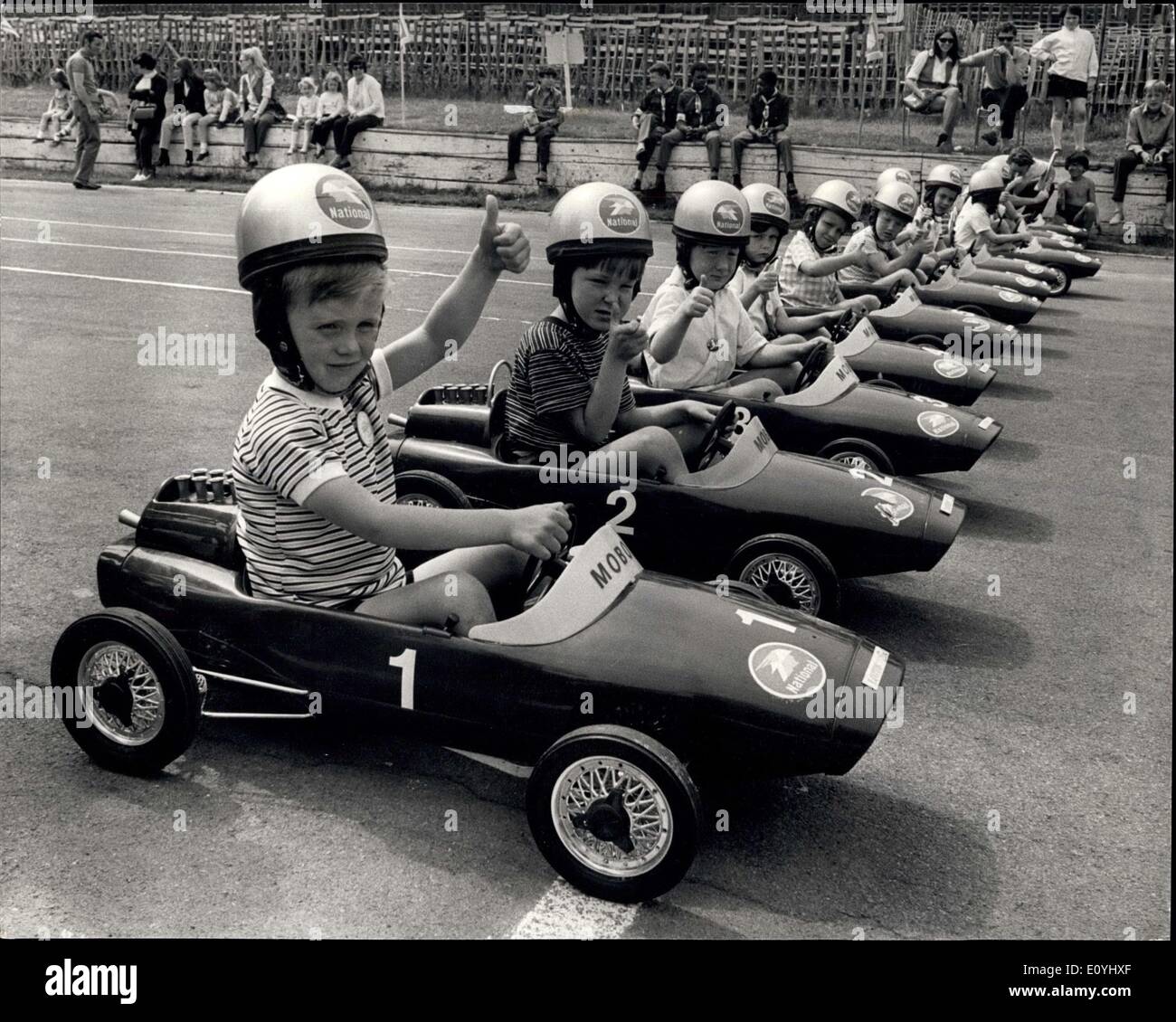 Jun. 07, 1970 - The Rac' Junior Grand Prix'' Race at Crystal Palace.: Britains's Young aspiring dirvers took part today in the Rac ''Junior Grand Prix''. The competitors were at the controlks of ''pedal-powered'' mini-racing cars as they made a 75-yards dash down a section of the motor racing circuit at Crystal Palace normally used by the more experienced racing drivers. The winner's prize was open to boys and girls aged 6 and under Photo shows The young competitors give the ''thumbs-up'' sign as they line up for the start of the race. Stock Photo