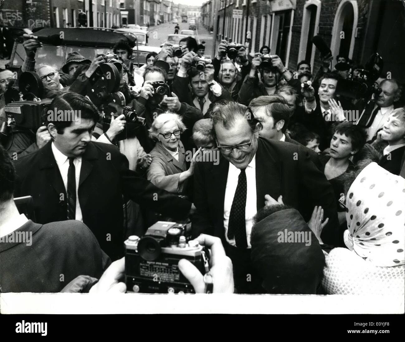 Jul. 07, 1970 - Mr. Maudling in Belfast. Photo shows Mr. Reginald Maudling, the Home Secretary, surrounded by a battery of cameramen, recieves a pat on the back from a woman during his tour of Belfast. Stock Photo