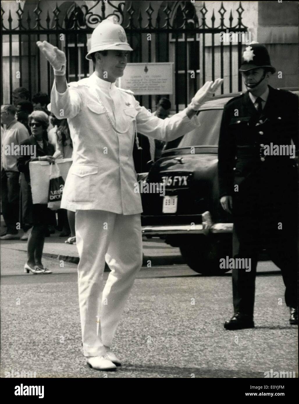 Jul. 07, 1970 - The Dancing Policeman Conduct London Traffic. As part of the British European Airways Fly East programme, a Yugoslav policeman is on a courtesy visit to London. He is one of the leading male dancers in the Belgrade Ballet Company. Standing 6ft. 6 In in his dress uniform (complete with pin helmet), this afternoon he realized an ambition to direct London's traffic in ballet style. He is 34 years old Jovan Bulj, from Belgrade, and while on duty at home, he amuses the motorists and pedestrians with his ballet movement Stock Photo