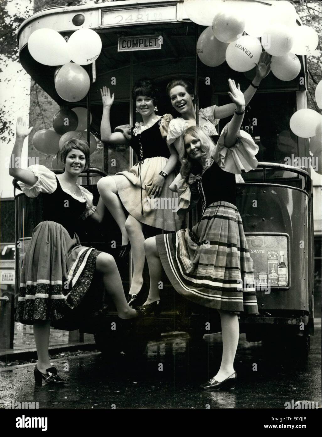 Jul. 07, 1970 - Vive le Kings road: Four attractive girls dressed in French peasant costume arrived at the ''Chelsea Drug Store'' public house in Kings Road, Chelsea today, in a genuine vintage Paris bus to introduce Pernod, the French national drink, to ''Les Citoyens'' of the Kings Road. Seven fashionable Kings Road pubs are cooperating in this celebration of Bastille Day the most important French National Holiday together with many of the boutiques. The girls will be distributing vouchers for Pernod through the normal licensing hours today Stock Photo