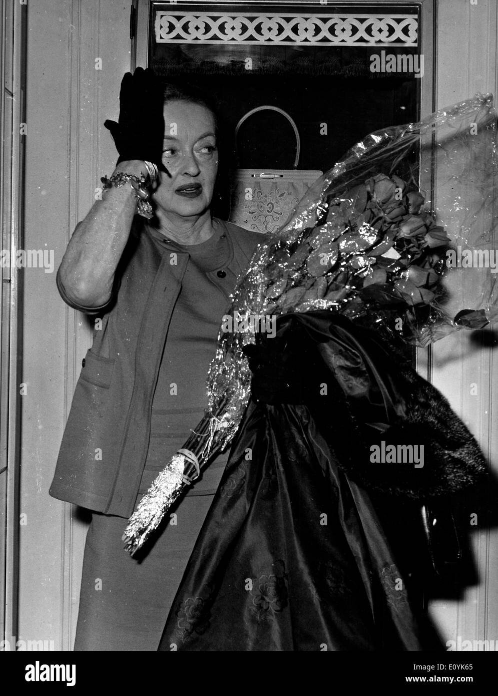 Actress Bette Davis receives flowers Stock Photo
